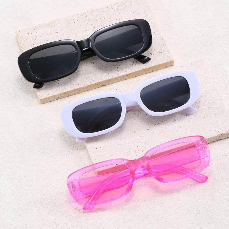 Sunglass Lover Jimmy Rectangle sunglasses trio in black white and translucent pink rectangular frames on stone