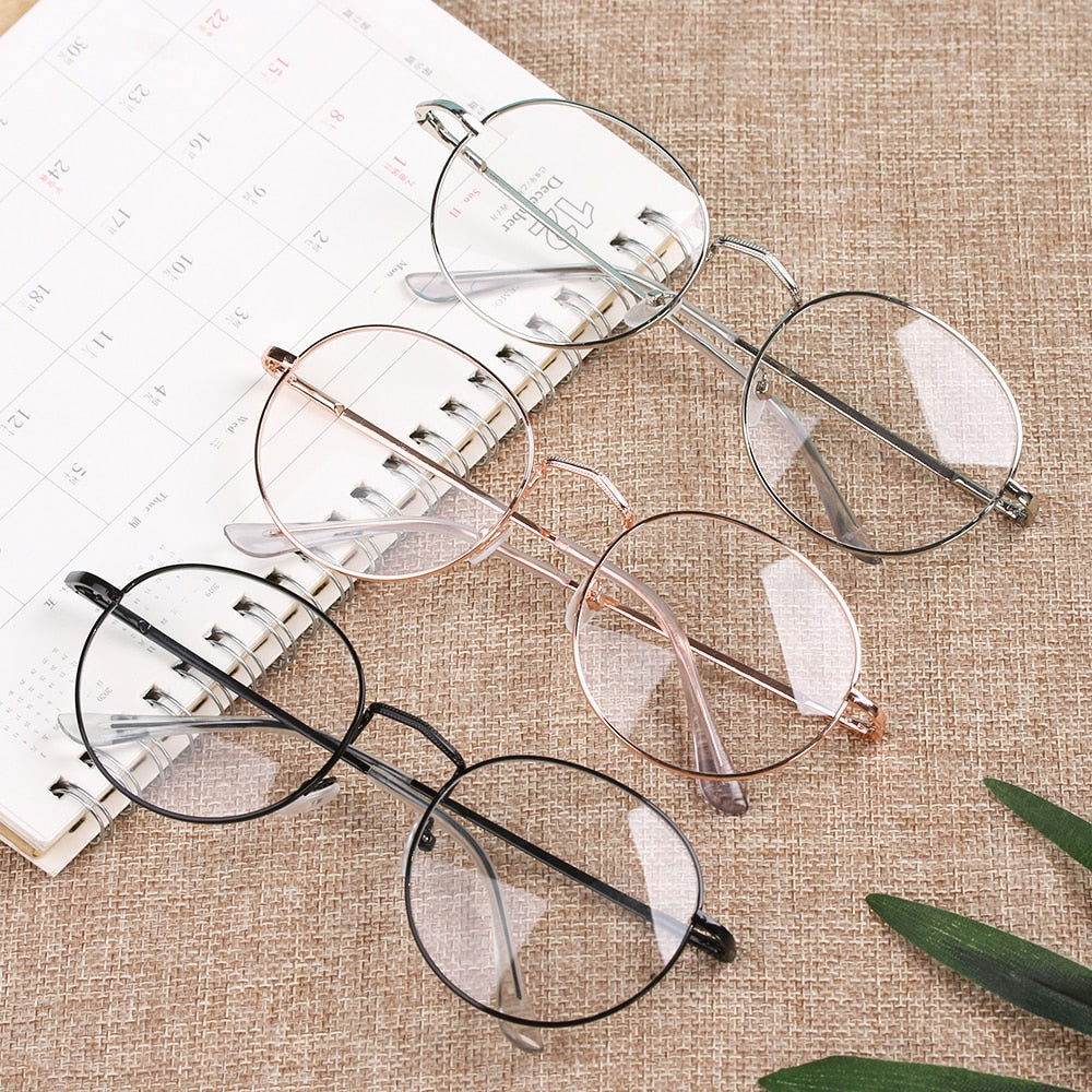 three round metal frame reading glasses in black rose gold and silver