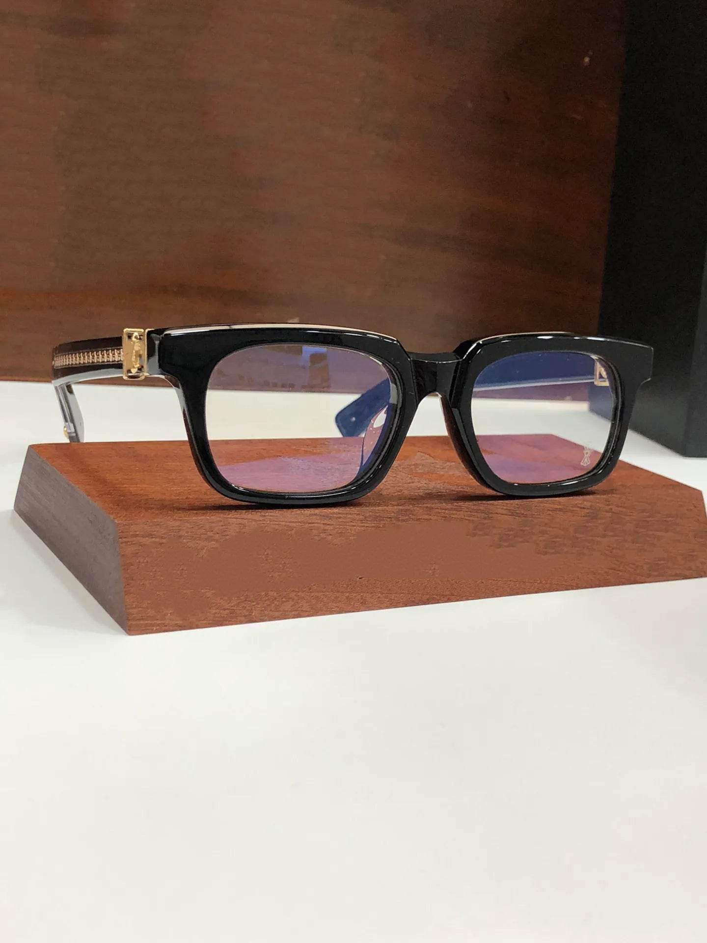 Sunglass Lover retro blue light blocking glasses black rectangular frame with gold hinge detail on display