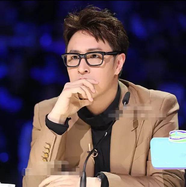 Sunglass Lover rectangle eyeglasses with black frames worn by seated man retro blue light blocking glasses for screen use