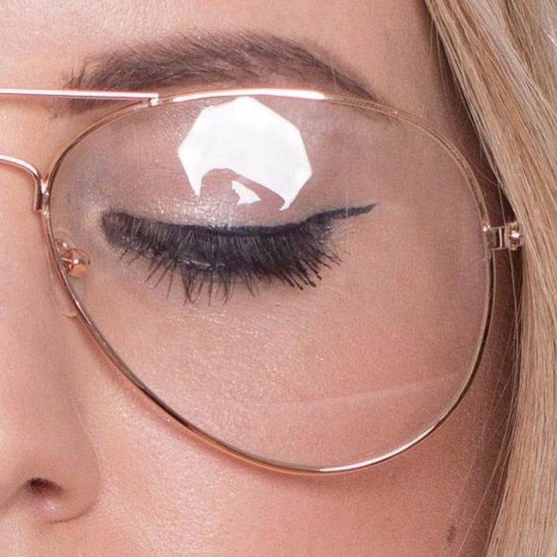 Sunglass Lover rose gold aviation metal frame eyeglasses close up of female model wearing clear lenses