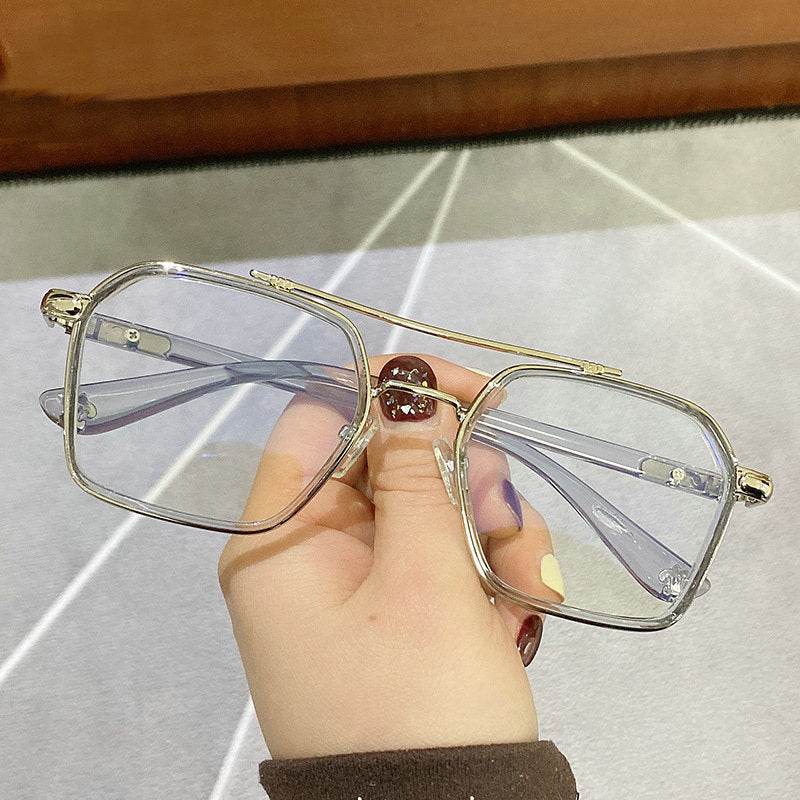 Sunglass Lover oversized square metal eyeglasses frames gold double bridge clear lenses held in hand