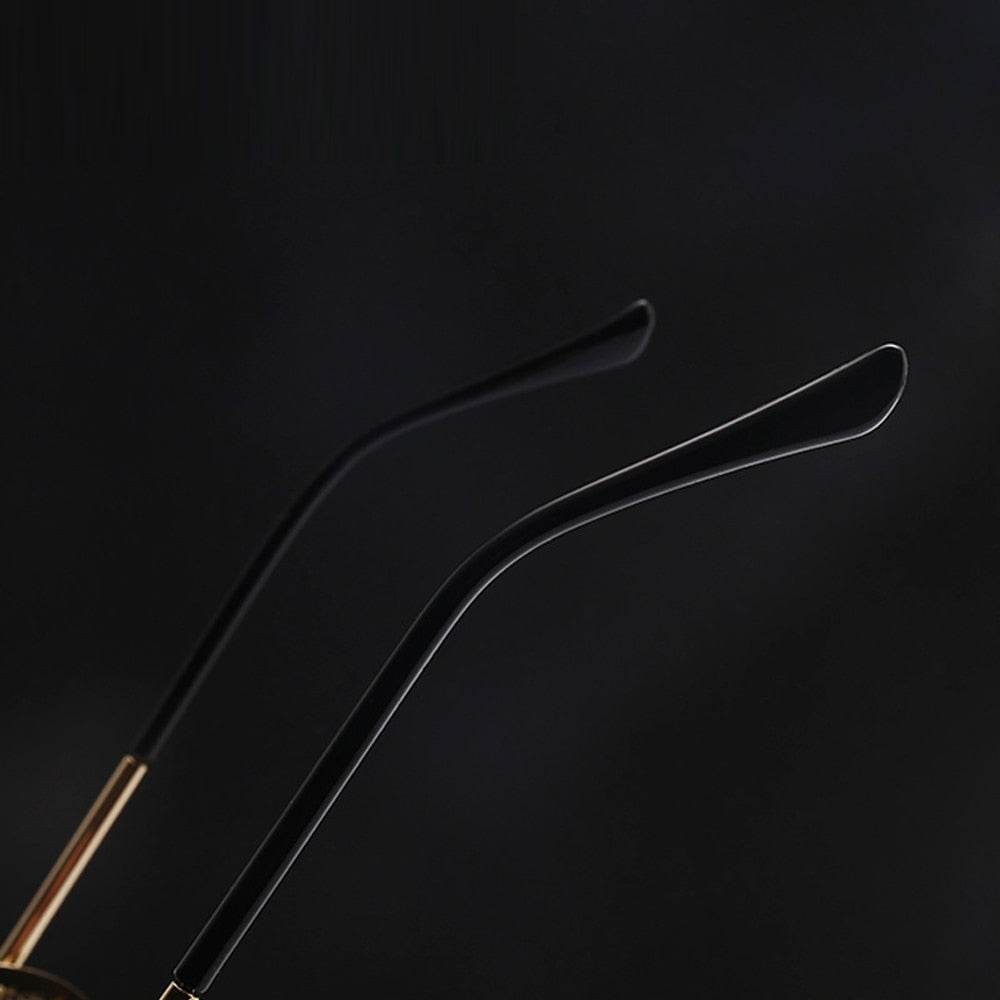 Sunglass Lover retro vintage round sunglasses black temple arms with gold hinges close up