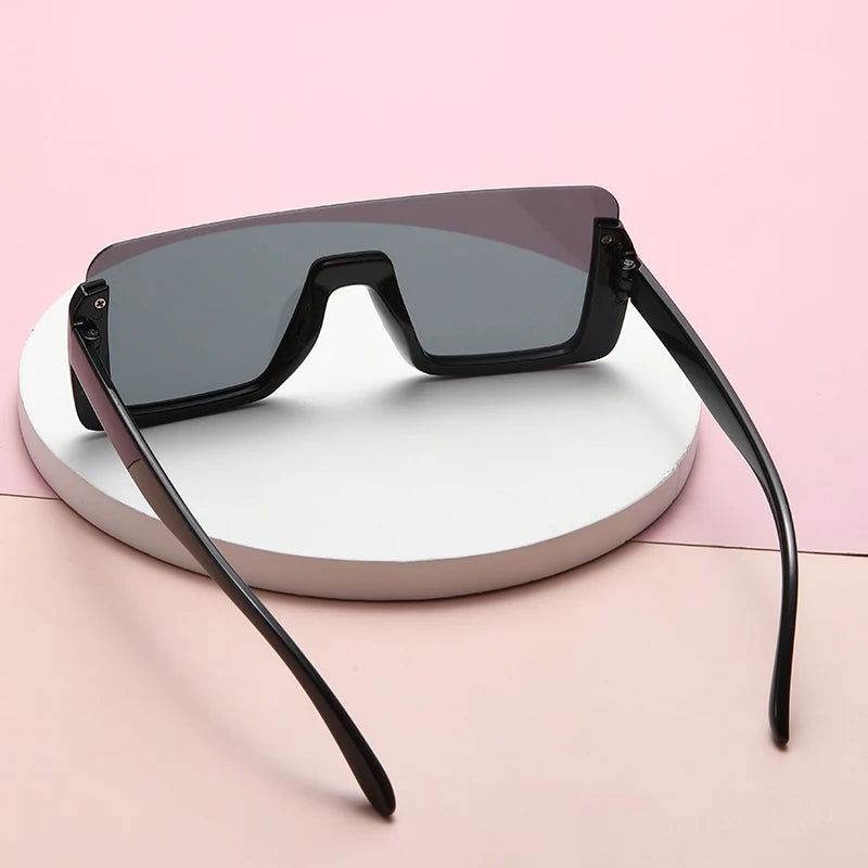 Allu Arjun inspired sunglasses by Sunglass Lover oversized black shield sunglasses with gray lenses and flat top