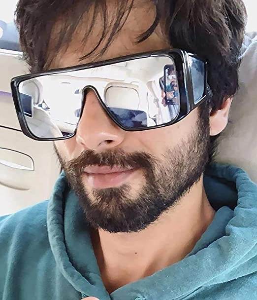 Bearded man wearing Sunglass Lover oversized mirrored shield sunglasses in car oversized sunglasses for men and women