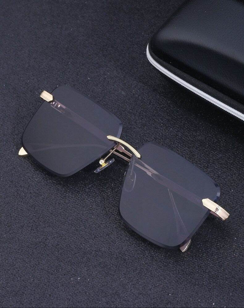Sunglass Lover oversize square rimless sunglasses dark smoked lenses gold bridge and temple tips
