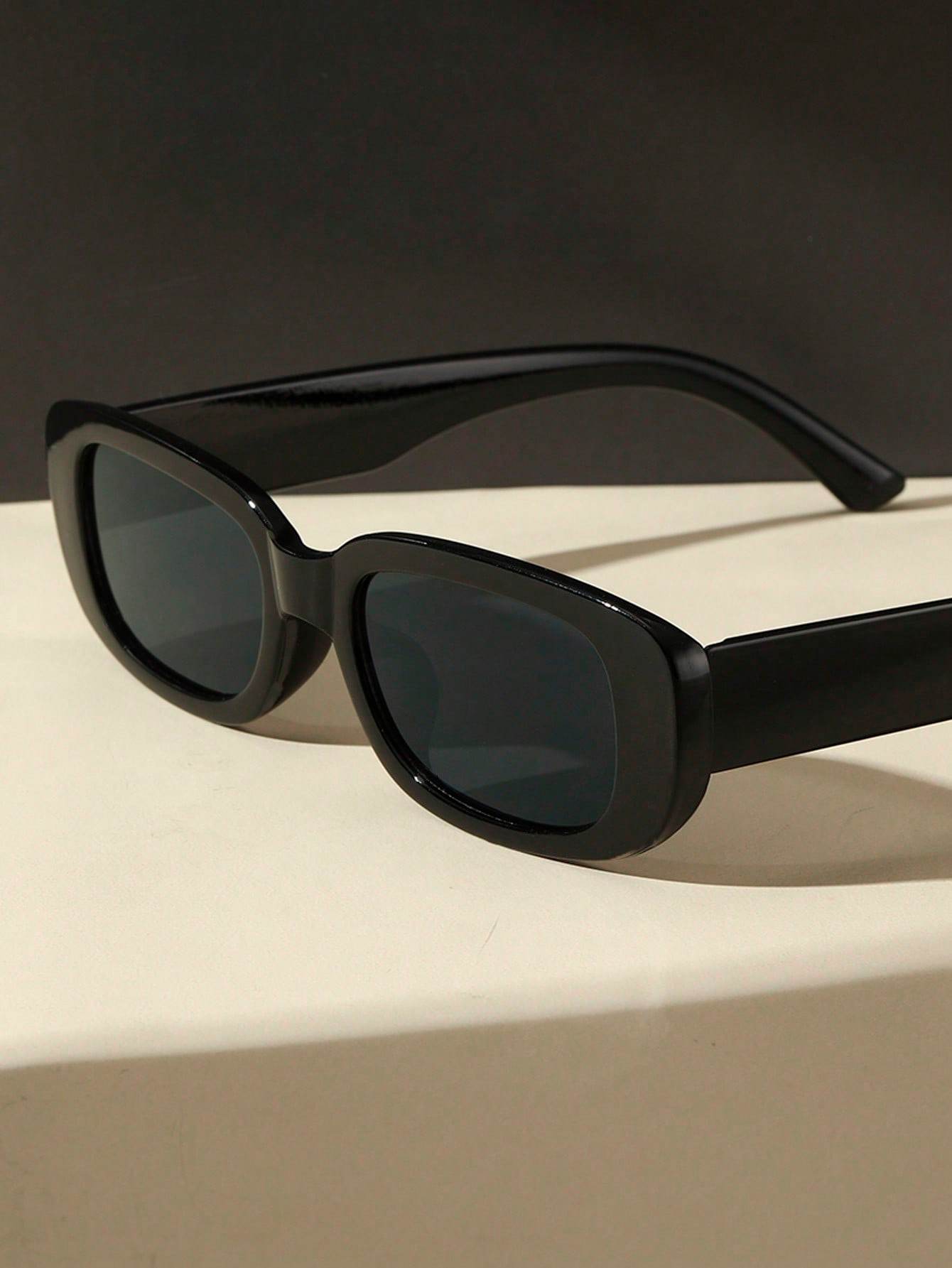 Sunglass Lover small rectangle sunglasses black glossy thick frame with dark lenses on beige surface