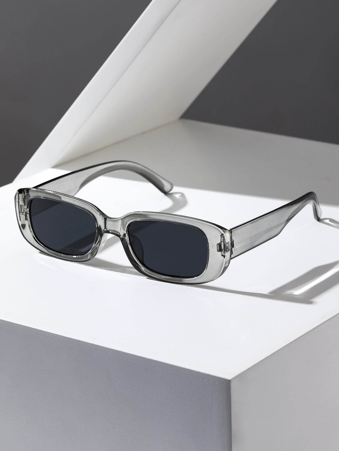 Sunglass Lover small rectangle sunglasses translucent gray frame with dark lenses on white display