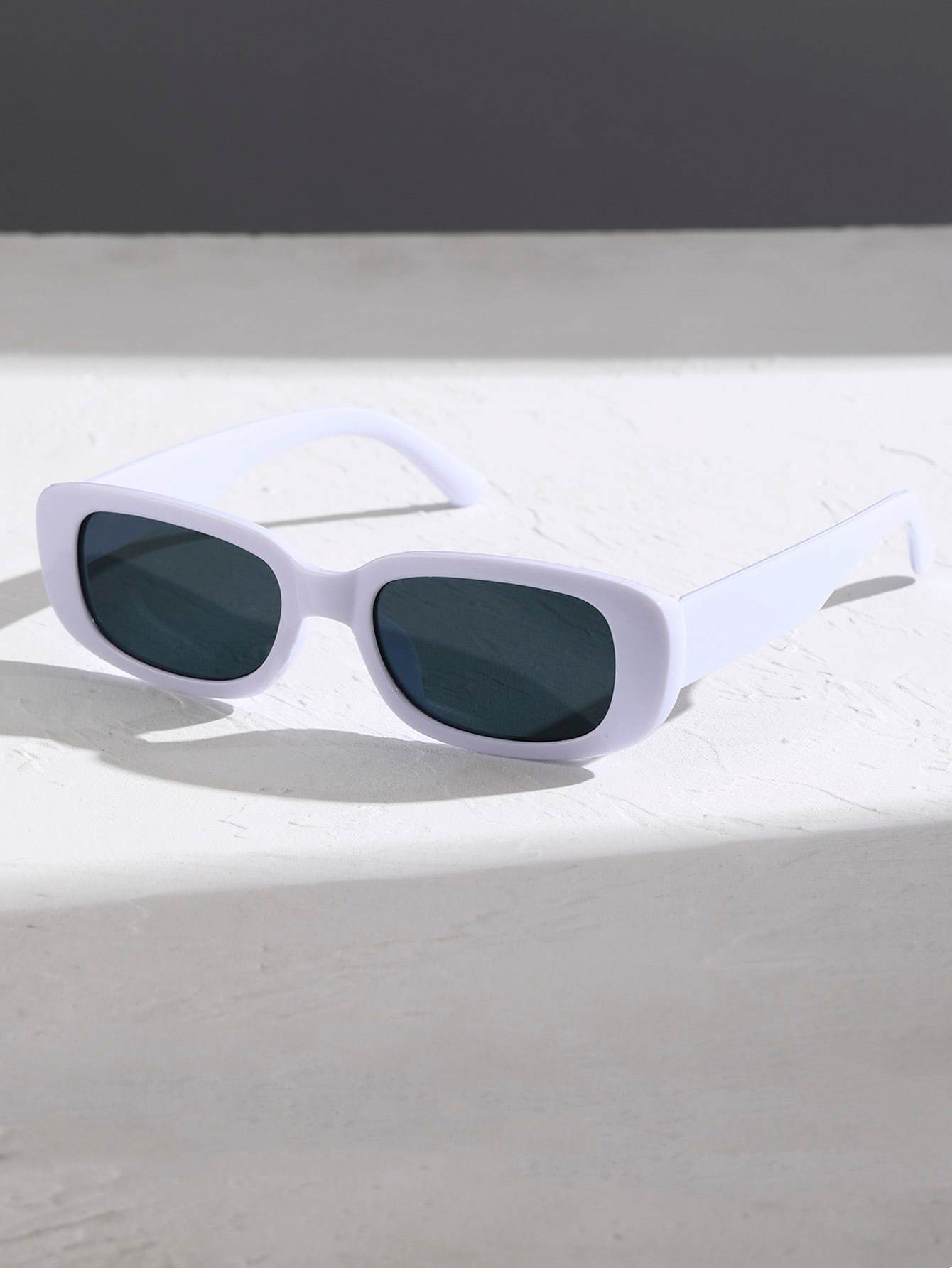 Sunglass Lover small rectangle sunglasses white frame with dark lenses on white textured surface