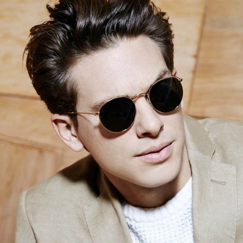 Sunglass Lover gold frame round sunglasses for men and women worn by man in beige blazer and white sweater