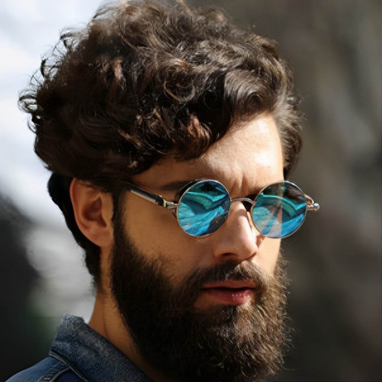Sunglass Lover stylish round frame sunglasses with blue mirrored lenses on bearded male model