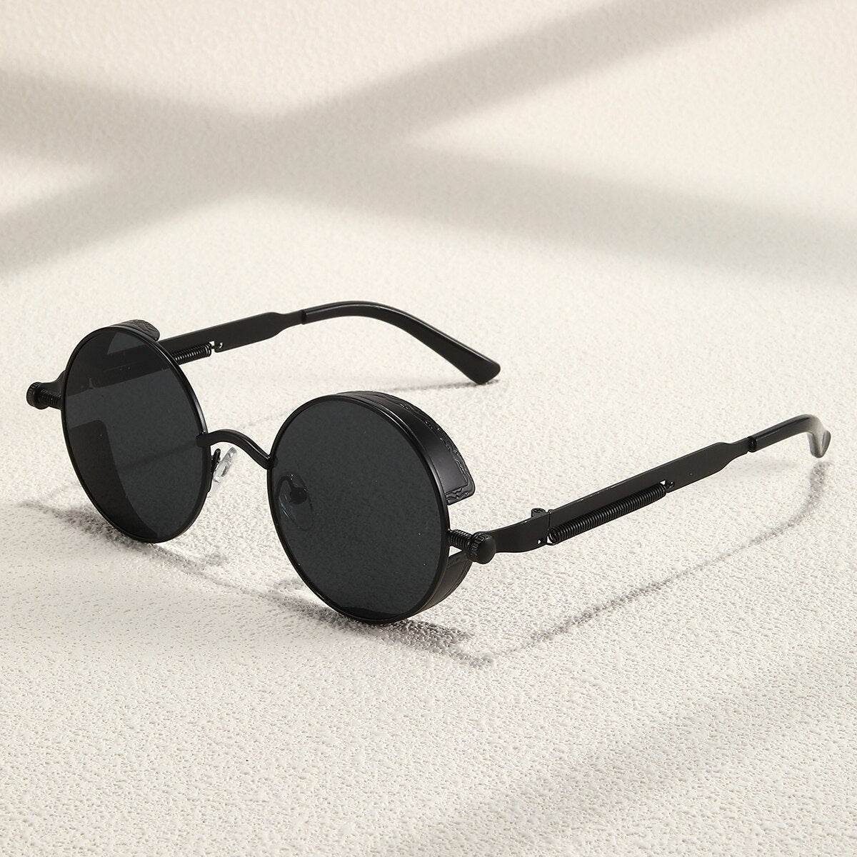 Sunglass Lover black metal vintage round sunglasses with dark lenses and thin temples for retro style