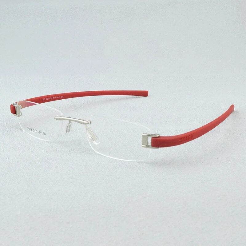 Sunglass Lover lightweight rimless eyeglass frames with red temple arms and silver bridge for everyday wear