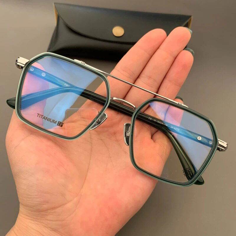 Sunglass Lover unisex hexagonal eyeglasses green metal frame with blue anti reflective lenses held in hand