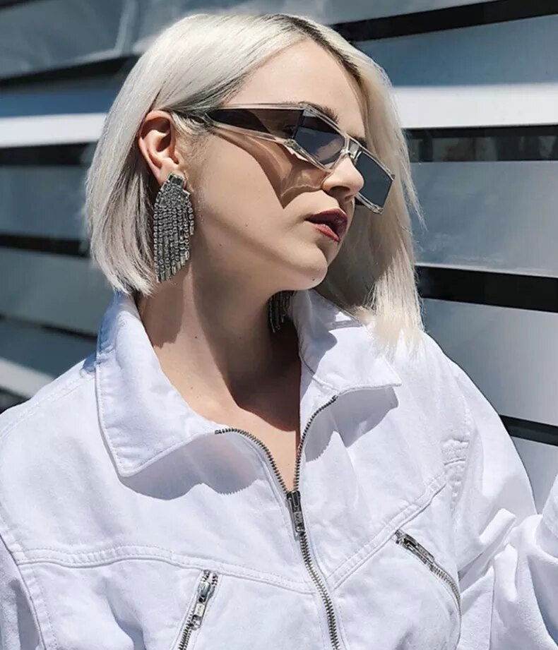 Sunglass Lover model wearing retro rectangle sunglasses for women with clear acetate frames and tinted lenses