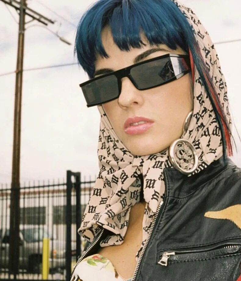 Sunglass Lover model wearing retro rectangle sunglasses for women black slim frame with scarf and leather jacket