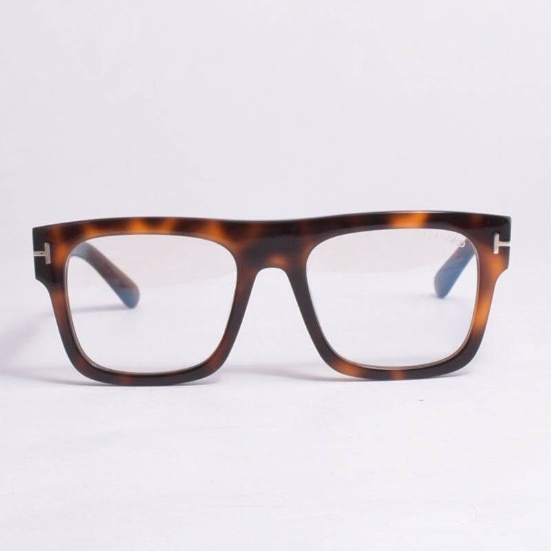 Trendy tortoiseshell eyeglasses with clear lenses and bold shape trendy square frame glasses unisex on white background