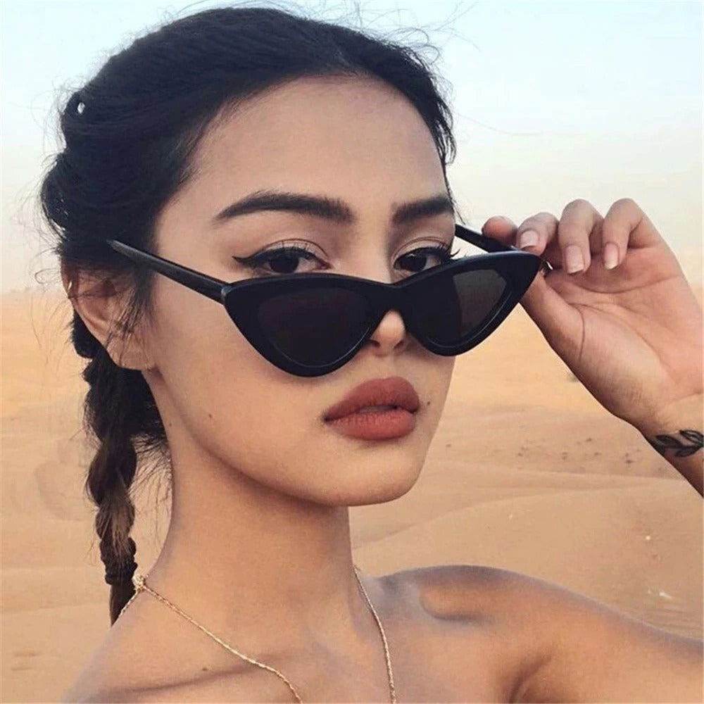 Sunglass Lover black small cat eye sunglasses trendy on model with braided hair in desert backdrop