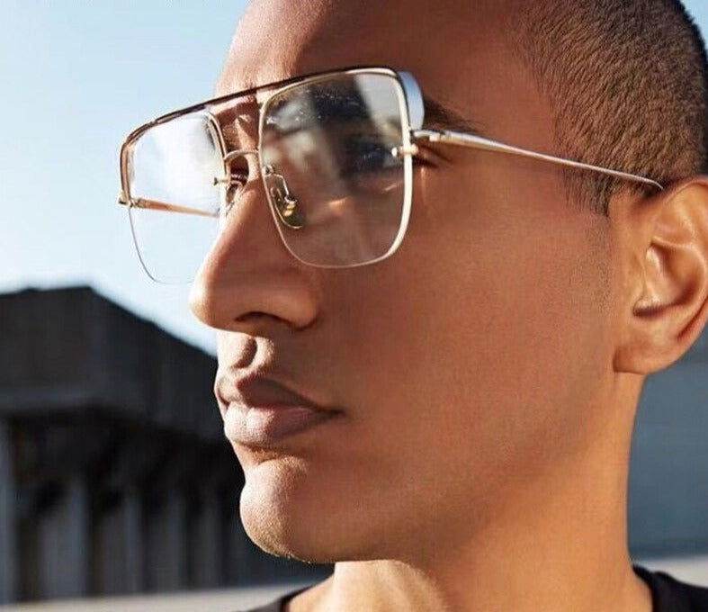 Sunglass Lover rimless punk style eyeglasses gold metal frame clear lenses worn by male model