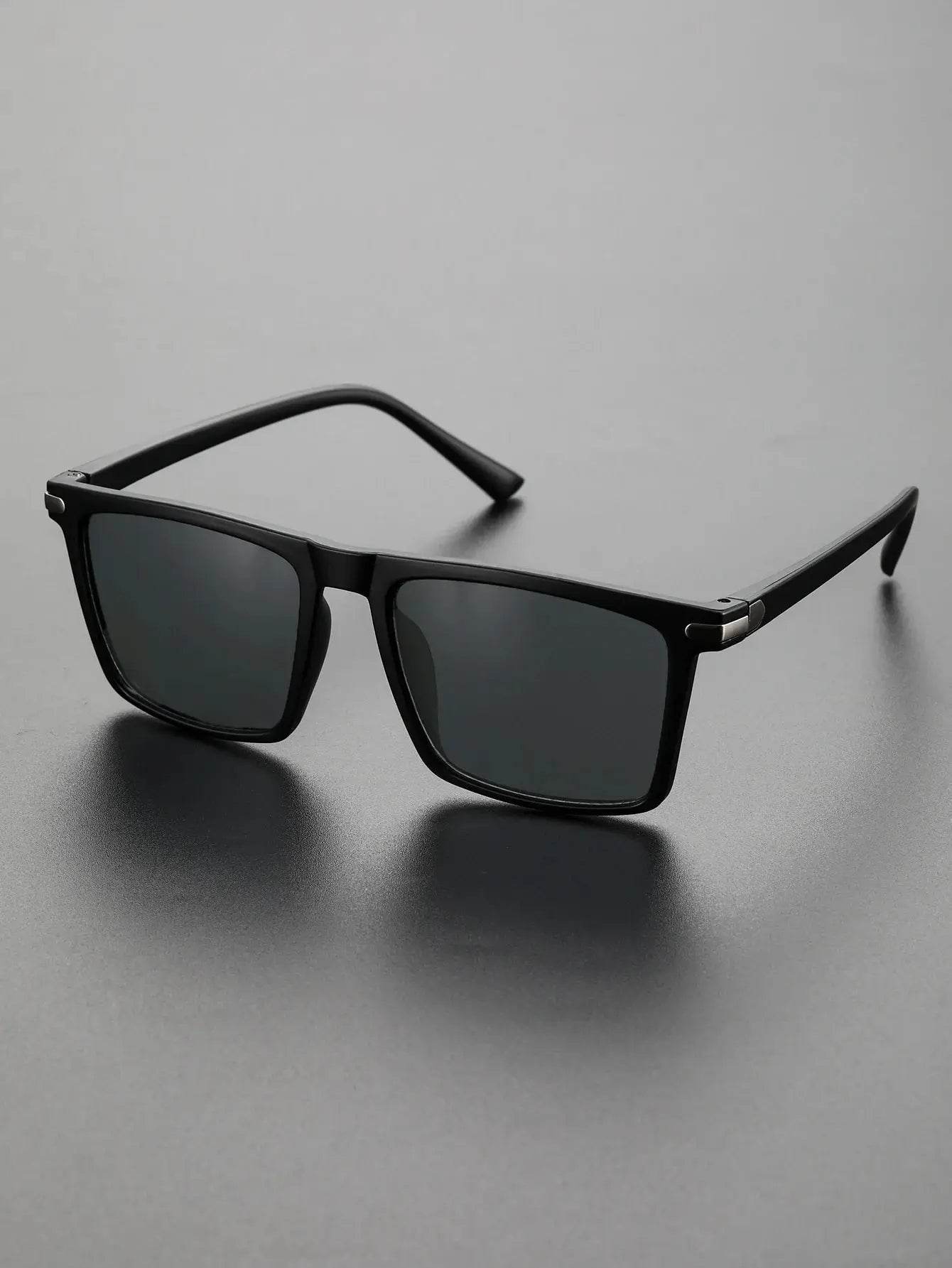 Sunglass Lover men's black square sunglasses with polarized dark lenses and lightweight matte frame on gray background