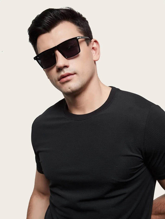 Sunglass Lover model wearing men's black square sunglasses with matte frame and UV protection