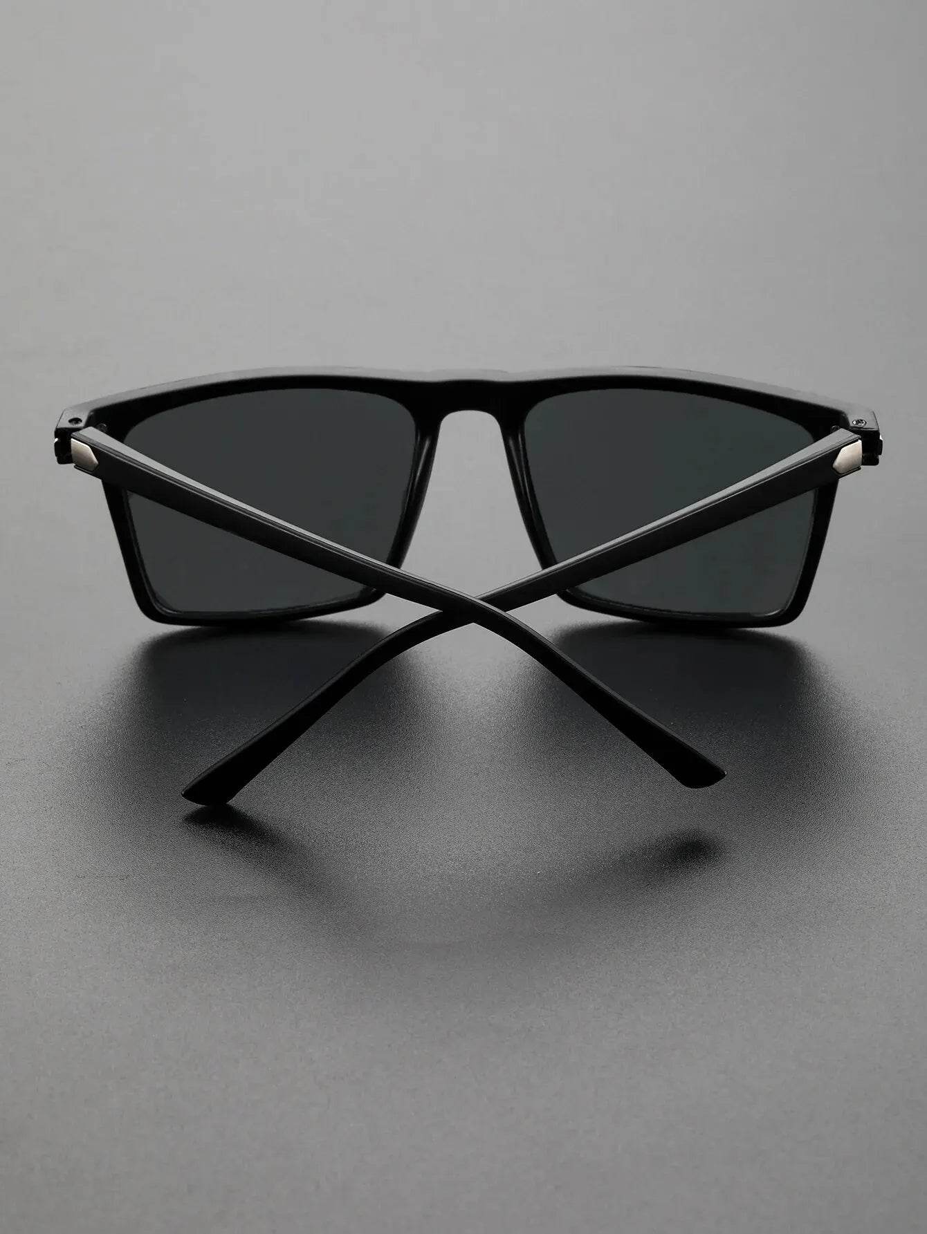 Sunglass Lover men's black square sunglasses with matte black frame and dark lenses, temples crossed