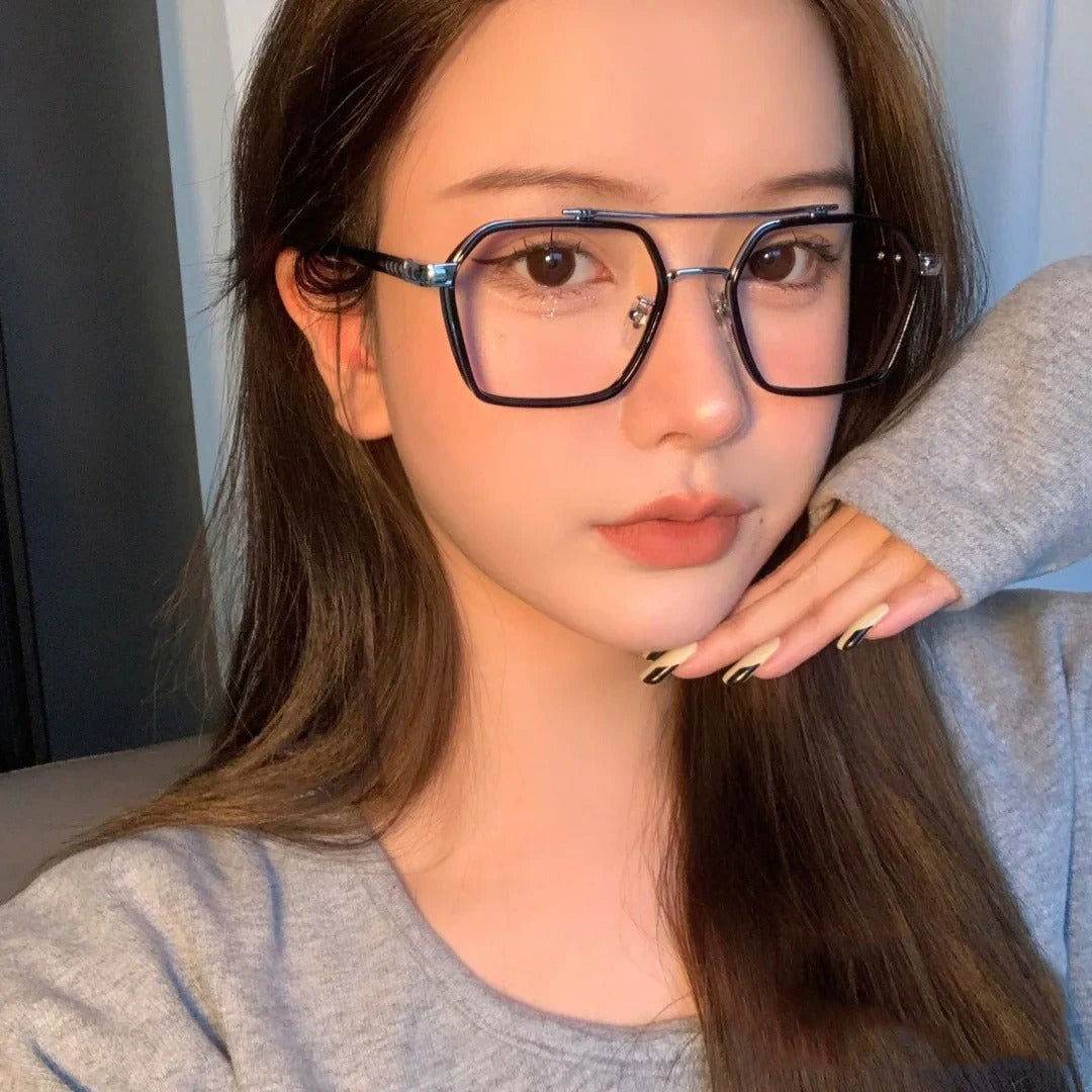 Sunglass Lover punk style blue light blocking eyeglasses large black square frames on young woman