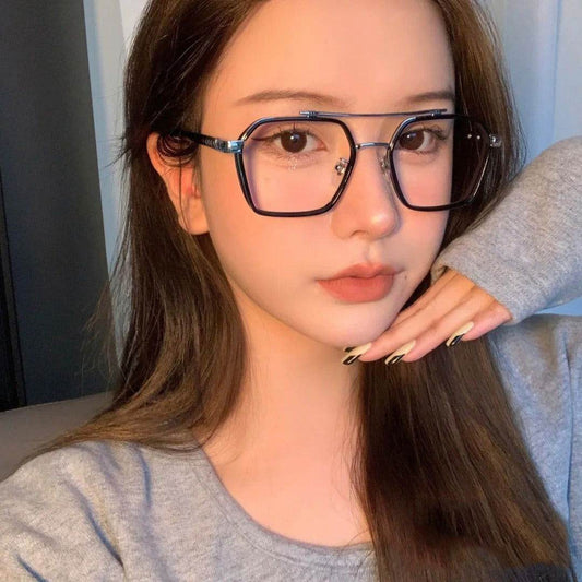 Sunglass Lover punk style blue light blocking eyeglasses large black square frames on young woman