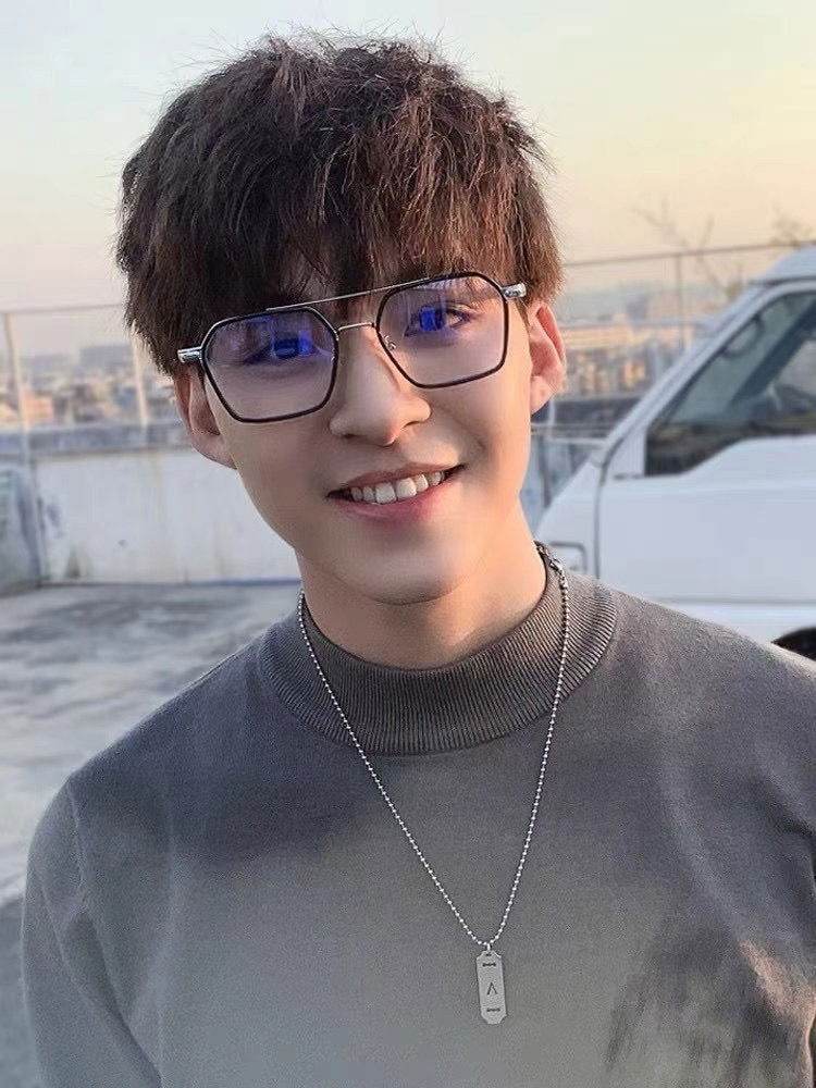 Sunglass Lover punk style blue light blocking eyeglasses on smiling young man with square metal frames