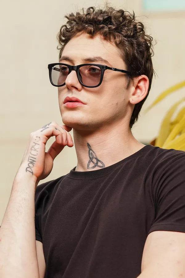 Sunglass Lover wayfarer sunglasses on male model with neck tattoo wearing UV protected photochromic glasses in black frame