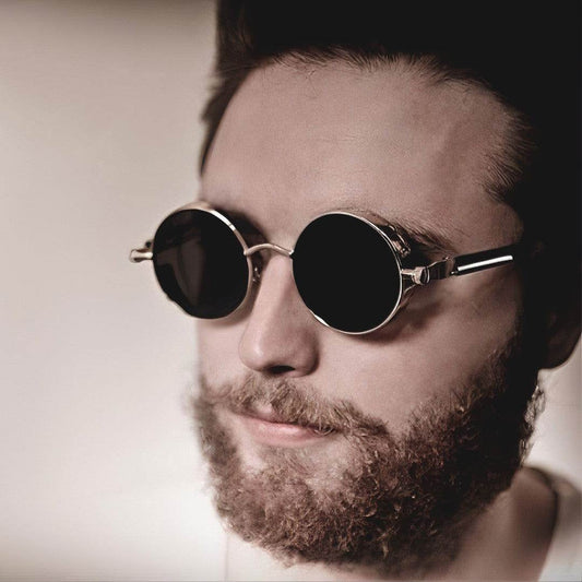 Sunglass Lover round steampunk sunglasses on bearded man with round dark lenses and metal frames