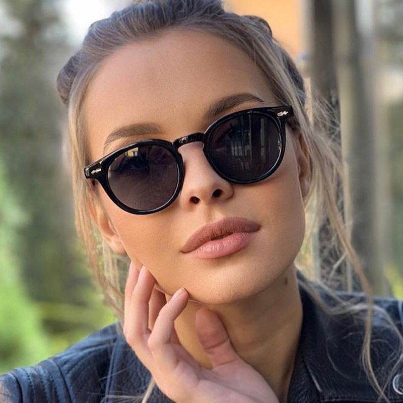 Sunglass Lover vintage round sunglasses for men and women black round frame on woman outdoors