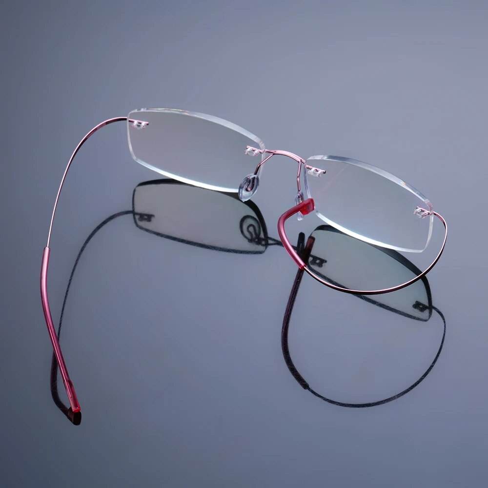 Sunglass Lover ultralight rimless titanium glasses with pink wire temples and clear lenses
