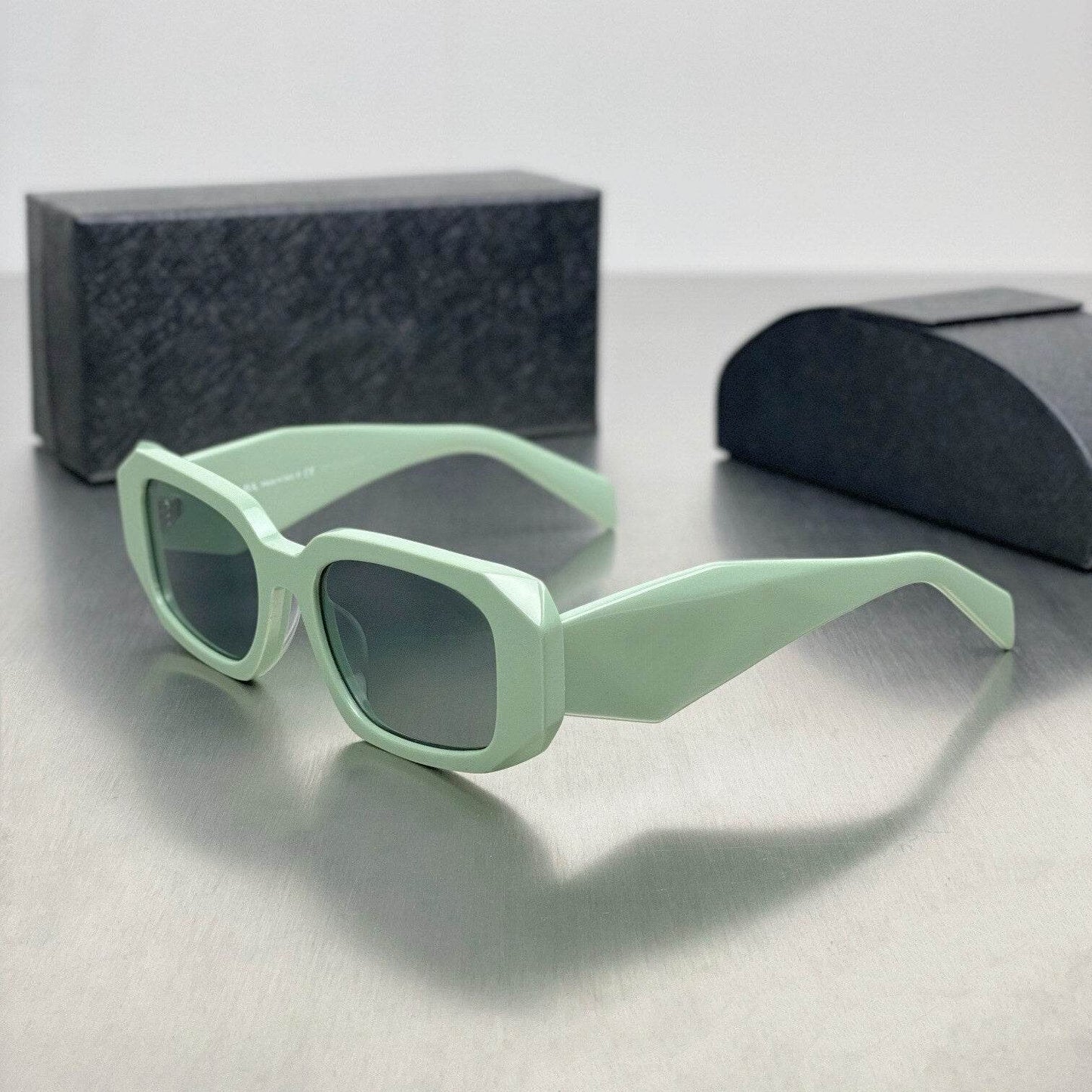 Sunglass Lover mint green narrow frame sunglasses for women with angular rectangular lenses and gradient gray tint